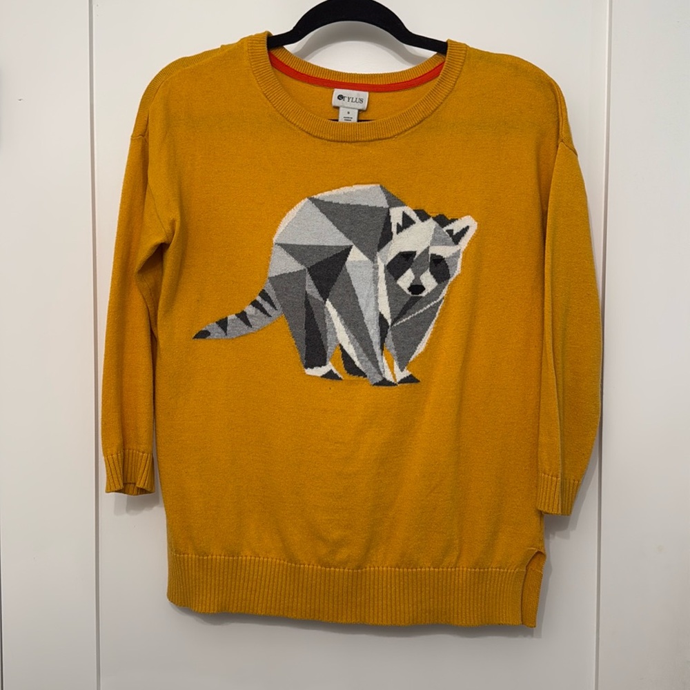 Soft knit sweater with a fun little raccoon!